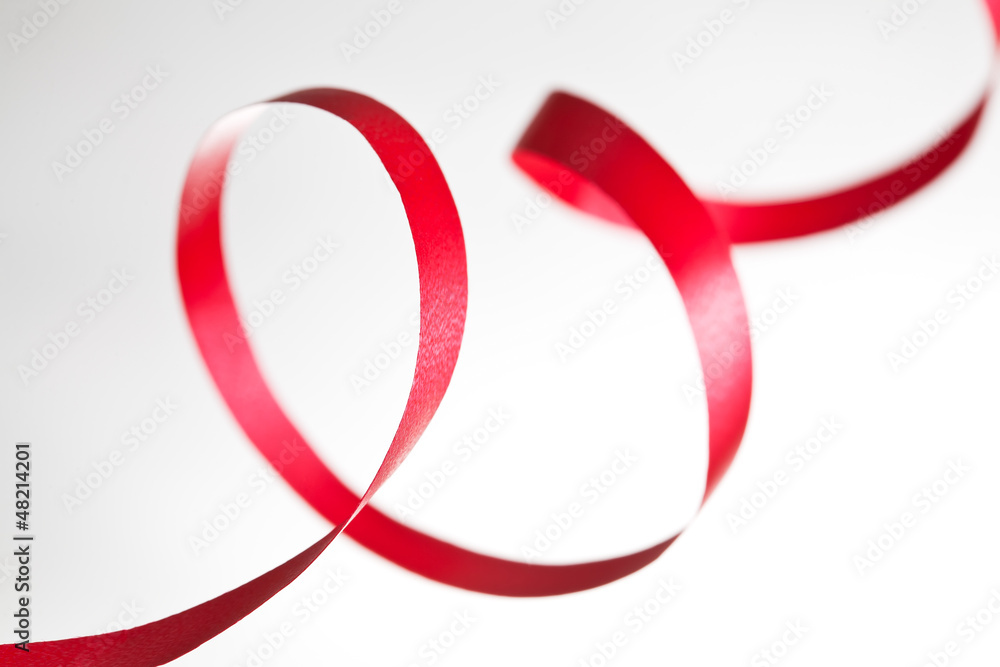 Fototapeta premium Red ribbon on white, abstract macro