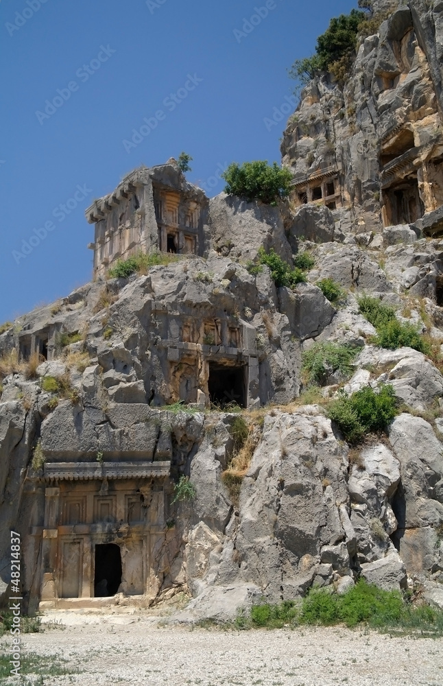 Historical tombs in the mountains near Myra town , Turkey .