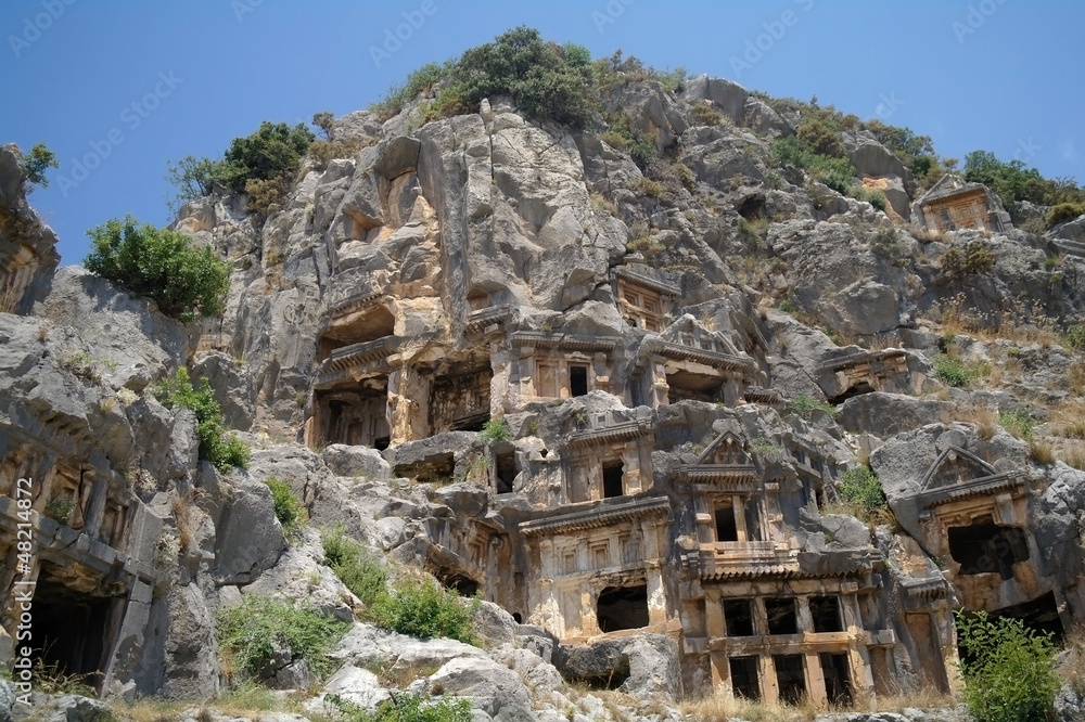 Historical tombs in the mountains near Myra town , Turkey .