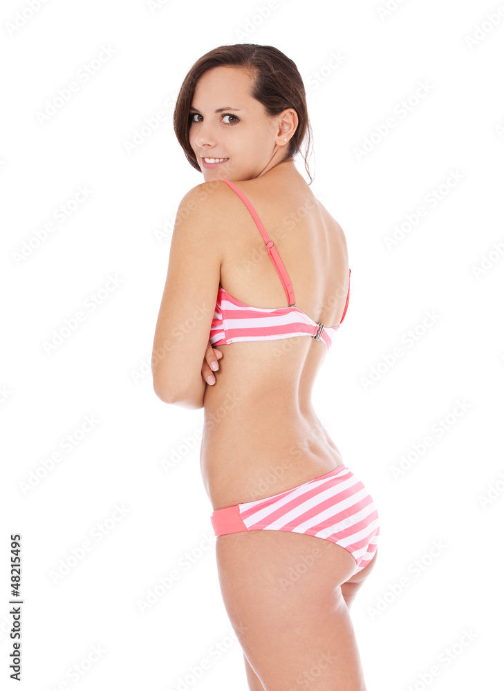 Attraktives Mädchen im Bikini mit Schulterblick Attraktives Mädchen im Bikini mit Schulterblick