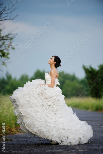 Happy bride in surrounding the nature
