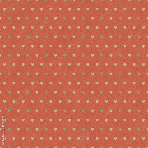 Seamless retro pattern of Valentine's hearts on paper texture.