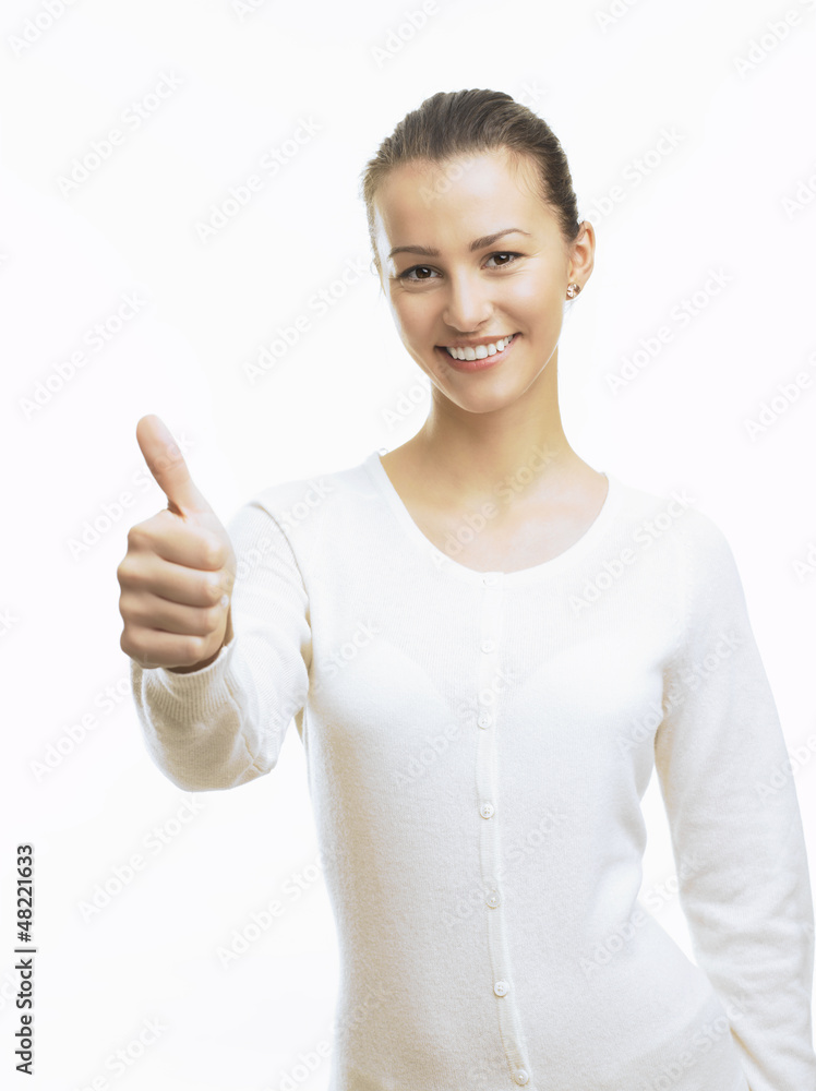 Close-up of a young woman showing thumbs up