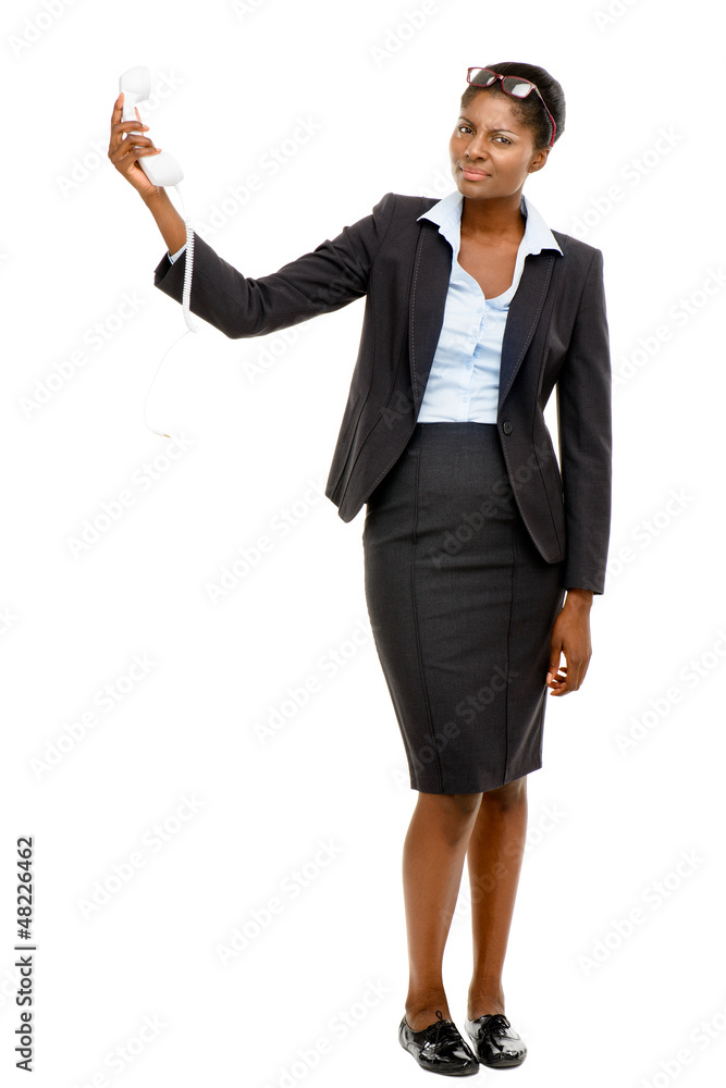 African American woman confused holding analogue phone isolated African American woman confused holding analogue phone isolated
