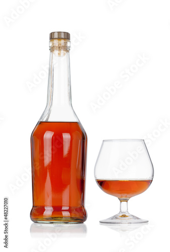 Congac bottle with glass isolated on white