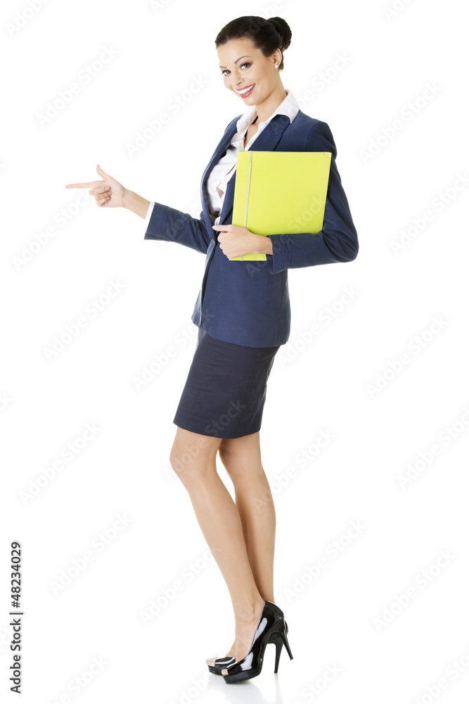 Success business woman pointing on copy space Success business woman pointing on copy space