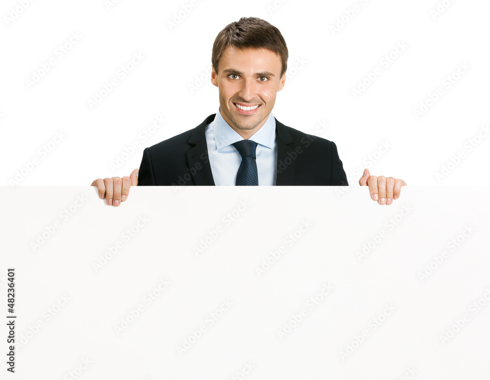Happy businessman showing signboard, isolated Happy businessman showing signboard, isolated