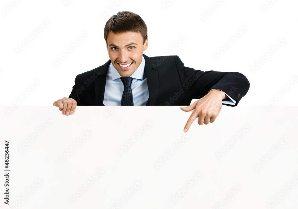 Happy businessman showing signboard, isolated Happy businessman showing signboard, isolated