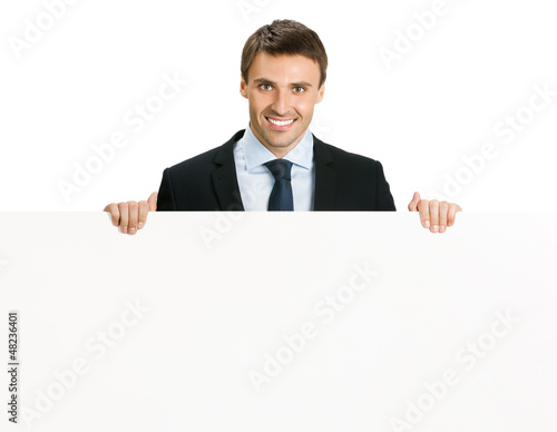 Happy businessman showing signboard, isolated