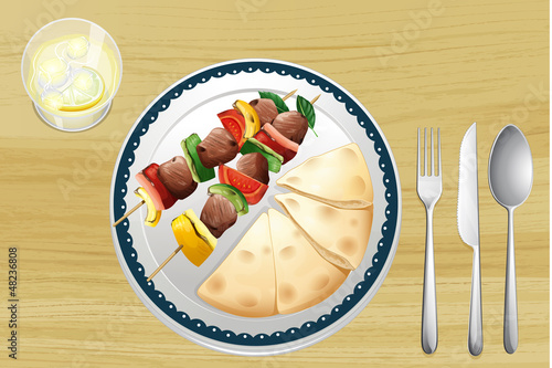 A meat spit and a bread