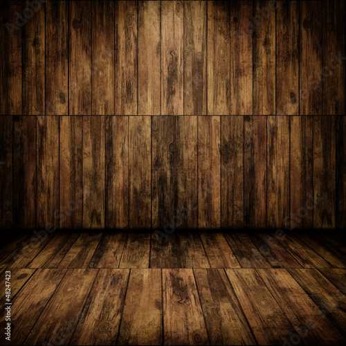 Grunge cabin interior with a wooden wall and floor