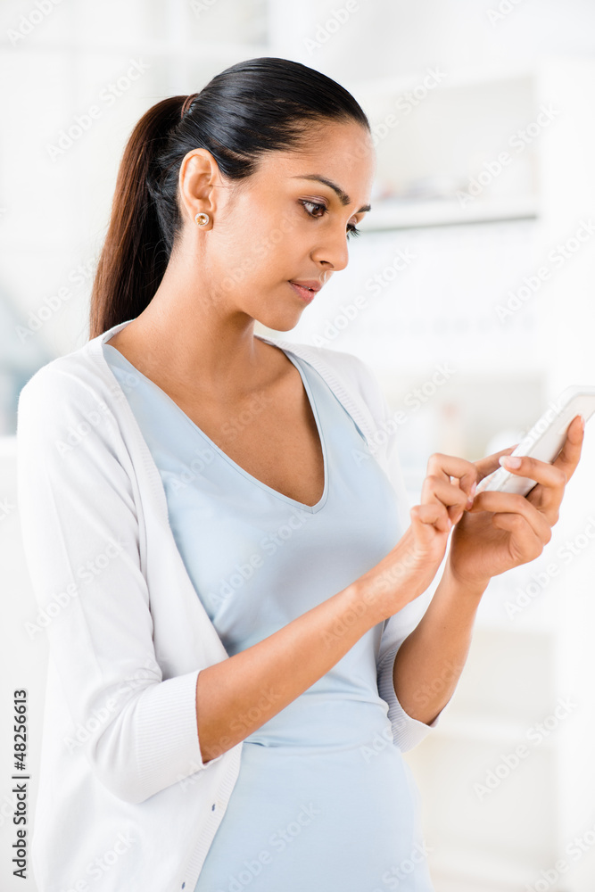 Beautiful Indian woman using mobile phone happy Beautiful Indian woman using mobile phone happy