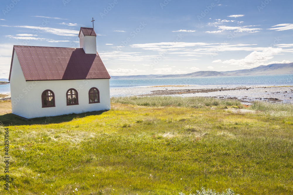 Wooden church on coast of Isafjardardjup fjord - Iceland.