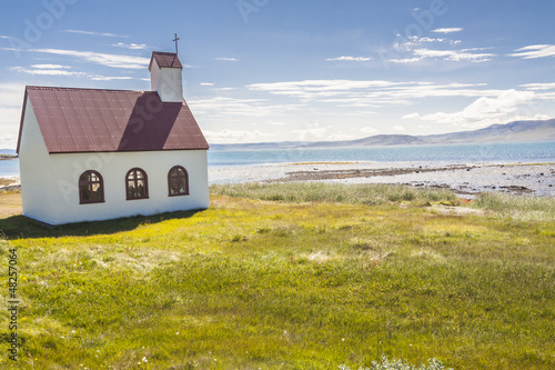 Wooden church on coast of Isafjardardjup fjord - Iceland. photo