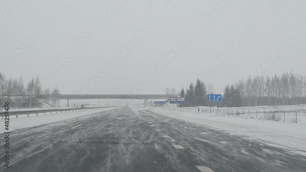 drive highway. snow fall dense snowstorm. car front window view drive highway. snow fall dense snowstorm. car front window view