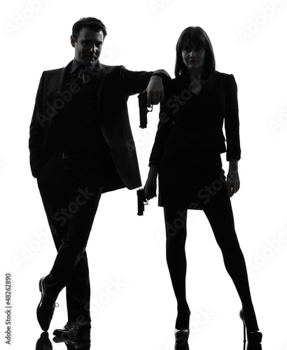 Obraz na plátně couple woman man detective secret agent criminal  silhouette