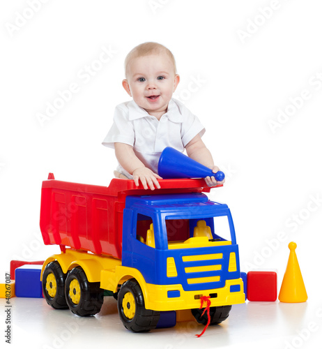 little child playing with c...