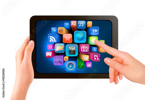 Hand holding touch pad pc and finger touching it's screen with i