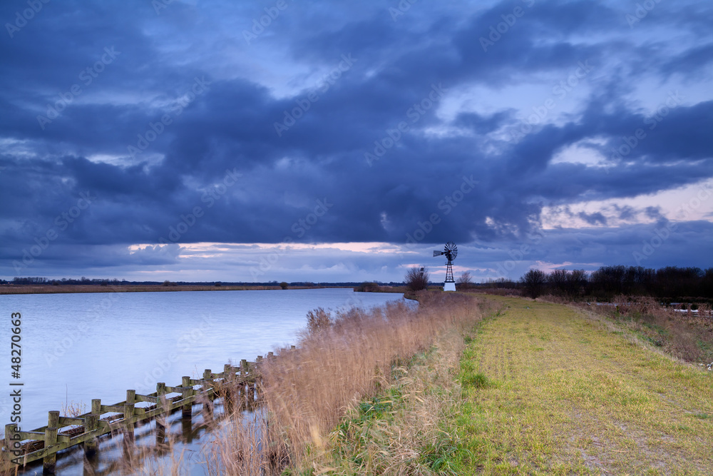 windmill during storm windmill during storm