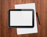 Digital tablet with pen on a desktop
