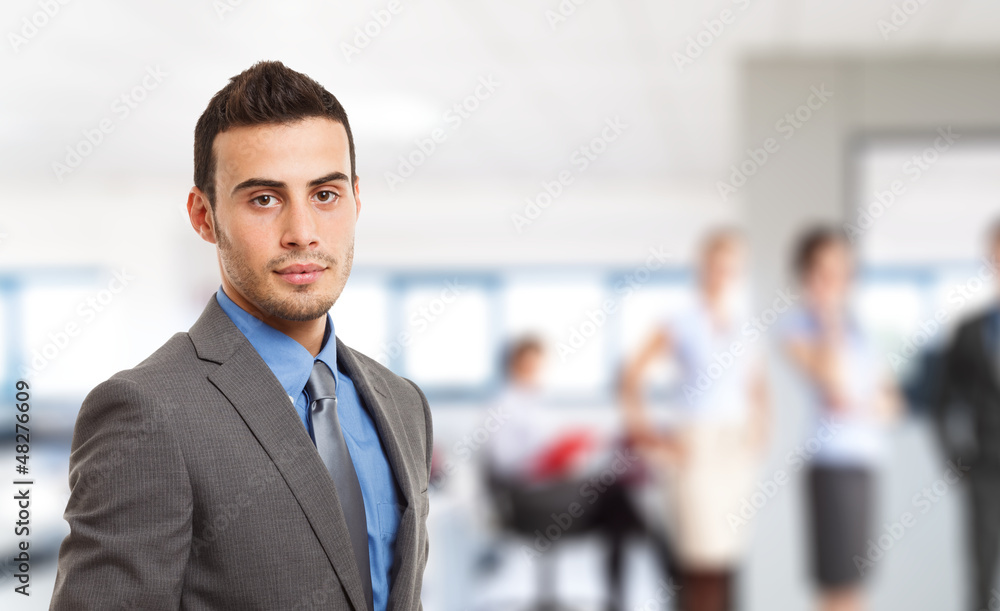 Businessman in front of his team Businessman in front of his team