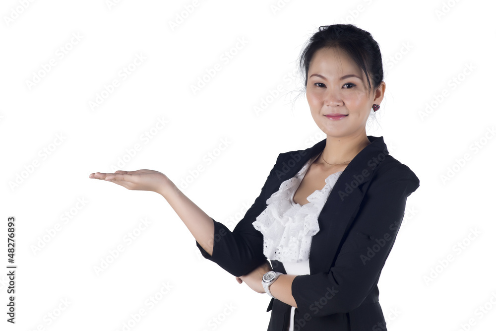Happy smiling young business woman showing blank area for sign o Happy smiling young business woman showing blank area for sign o
