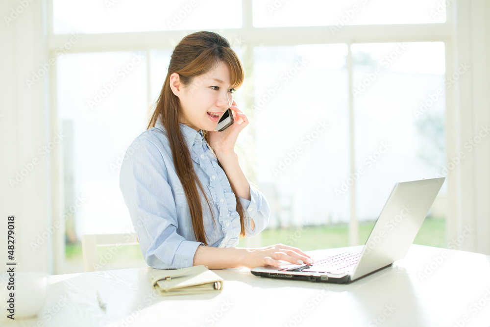 Beautiful asian businesswoman using a laptop computer Beautiful asian businesswoman using a laptop computer