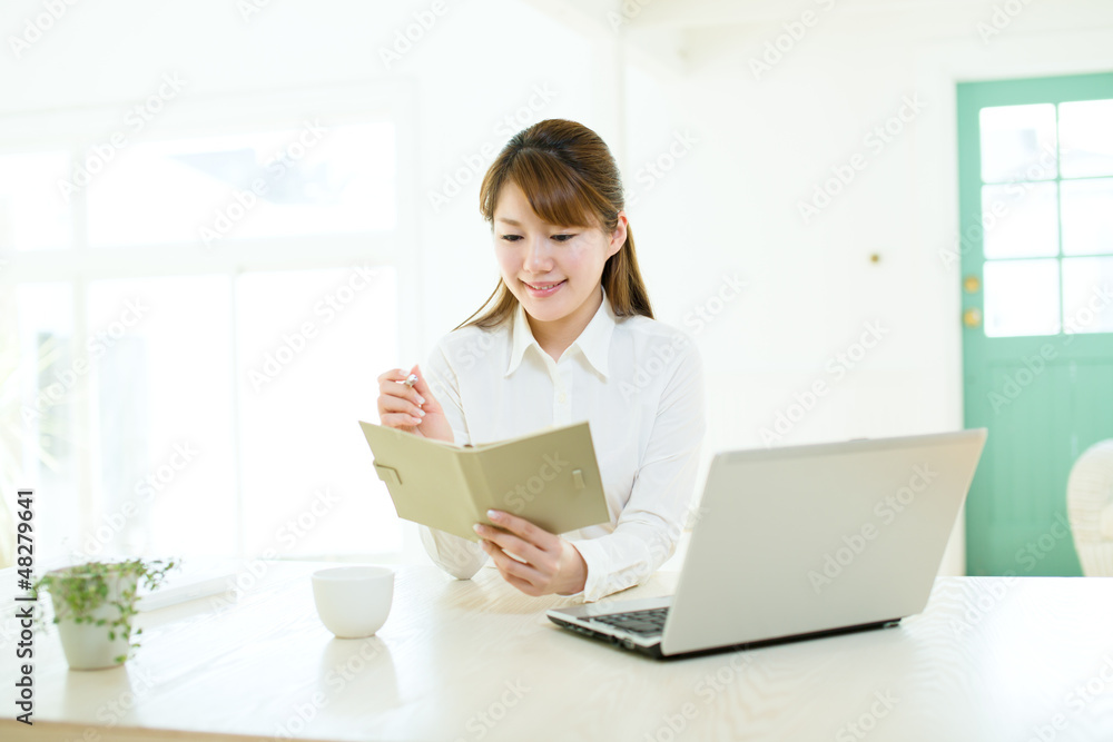 Beautiful asian businesswoman using a laptop computer Beautiful asian businesswoman using a laptop computer