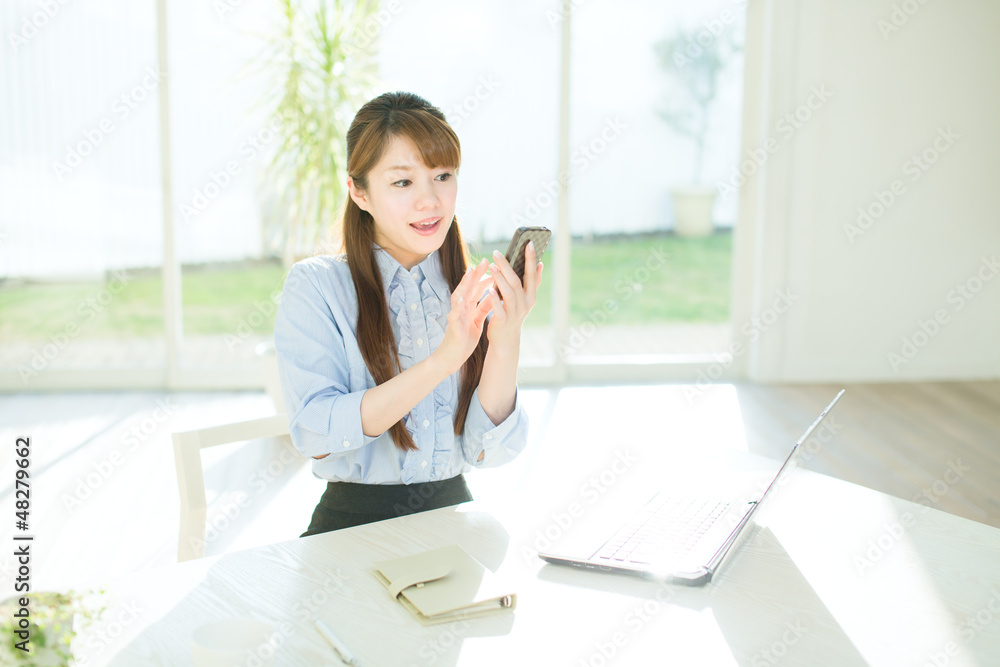 Beautiful asian businesswoman using a laptop computer Beautiful asian businesswoman using a laptop computer