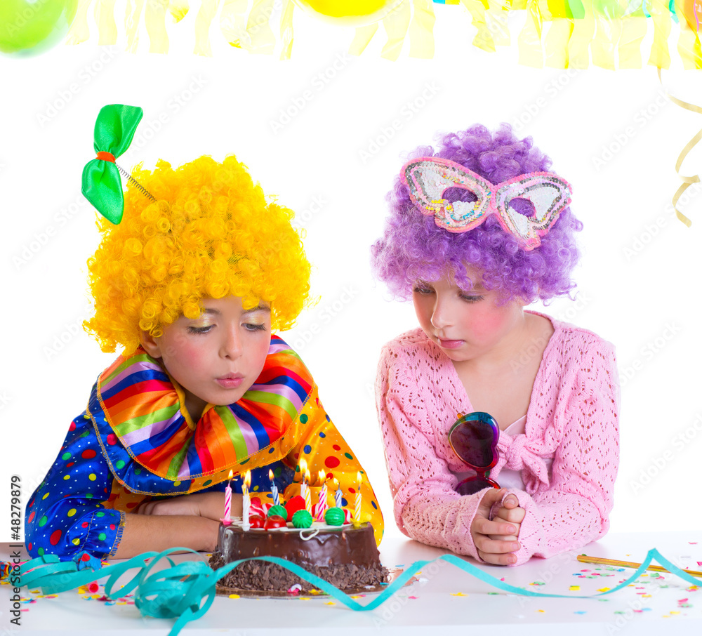 Children birthday party clown wigs blowing cake candles Children birthday party clown wigs blowing cake candles