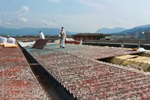 Asbestos removal on a roof of an industry