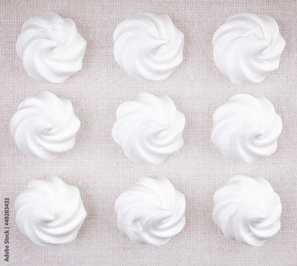 Top view of nine white meringue cookies Top view of nine white meringue cookies