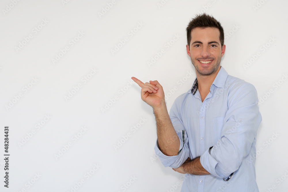 Cheerful young man showing message on whiteboard Cheerful young man showing message on whiteboard