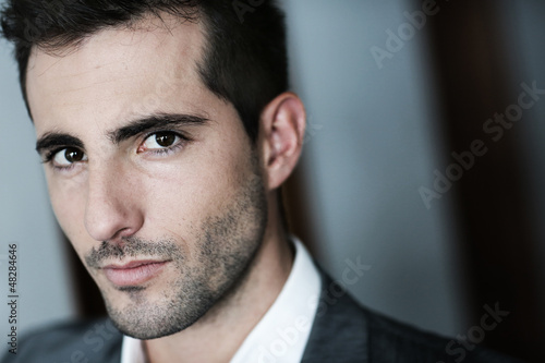 Portrait of handsome man on dark background