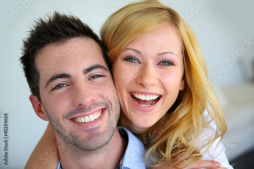 Cheerful in love couple at home