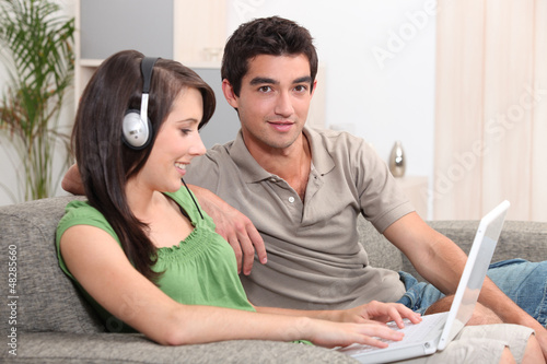 Teens sitting on couch