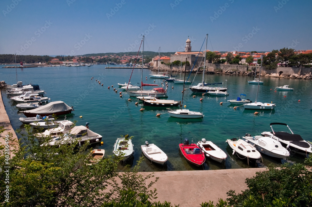 Boats on little port beside Krk old town - Croatia