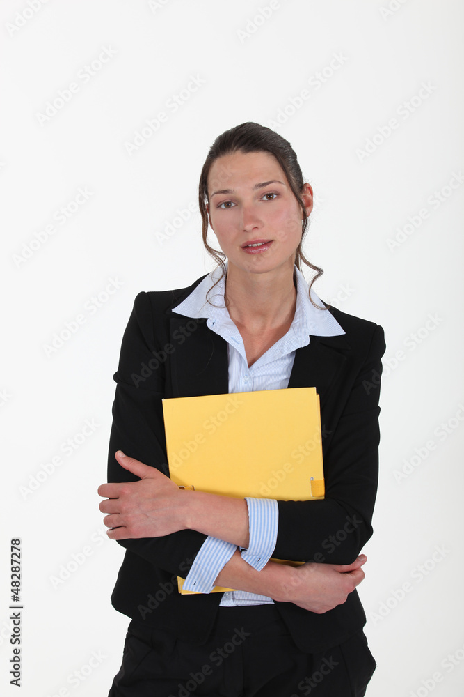 young woman in suit holding a folder