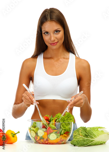 beautiful young woman with salad, isolated on white photo