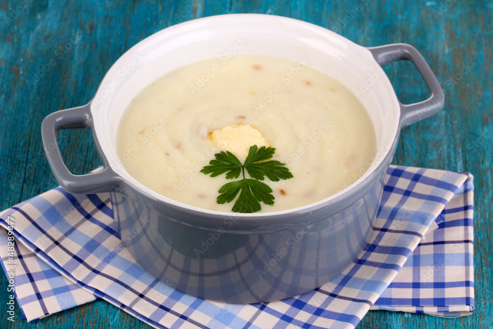 Mashed potatoes in saucepan on blue wooden table Mashed potatoes in saucepan on blue wooden table