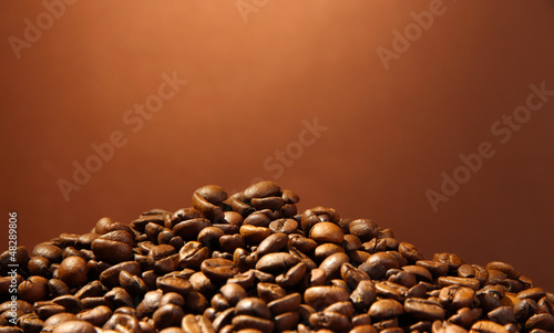 coffee beans on brown background © Africa Studio