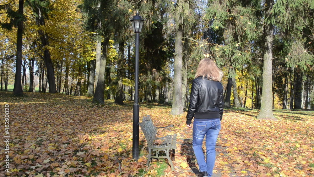 autumn leaf fall park beautiful woman walk sit bench light pole autumn leaf fall park beautiful woman walk sit bench light pole