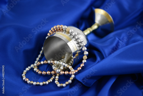 Gold silver and pearls on a blue silk