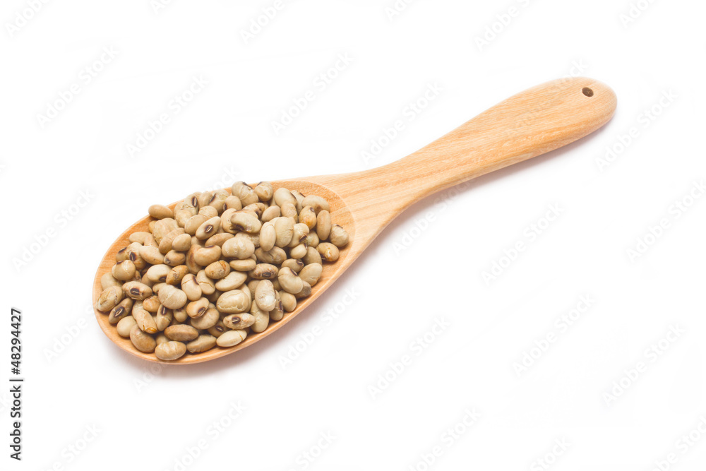 Soybean fried with wooden spoon isolated on white background. Soybean fried with wooden spoon isolated on white background.