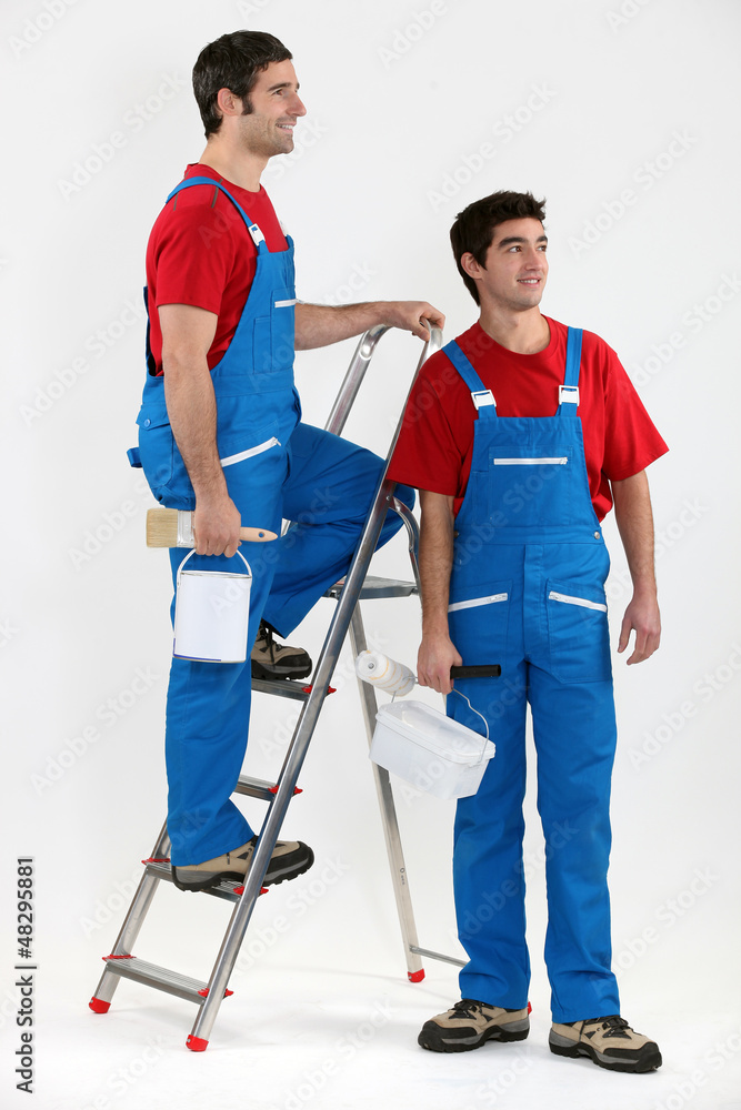Two decorators stood by ladder Two decorators stood by ladder