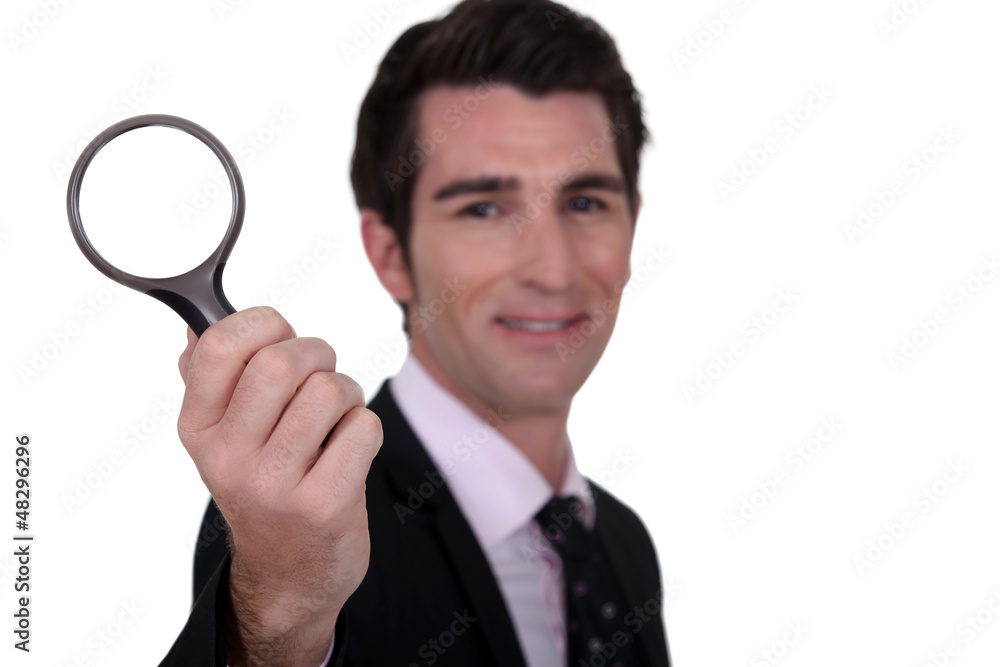 detective holding magnifying glass isolated on whiet detective holding magnifying glass isolated on whiet