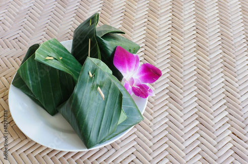 Thai dessert wrapped in banana leaves