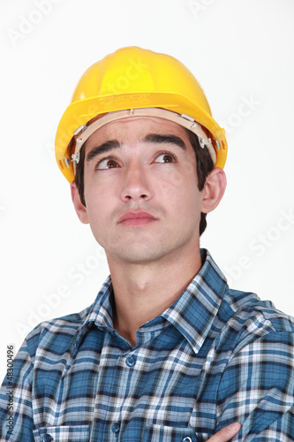 Pensive construction worker