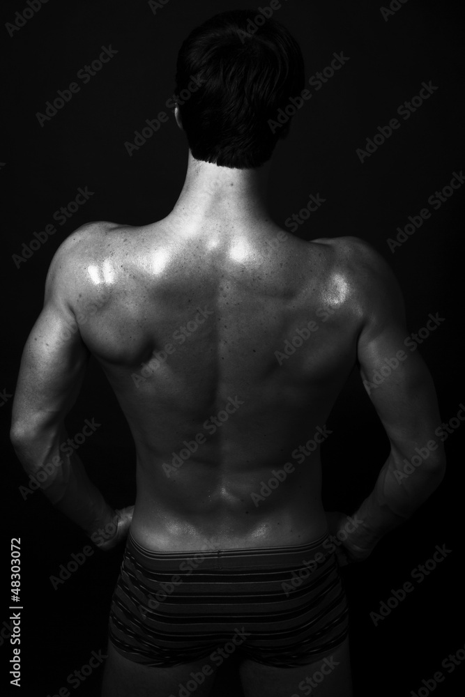 Strong fitness back of young handsome man Strong fitness back of young handsome man