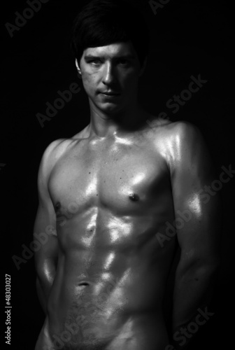 Studio fashion shot of strong fitness handsome naked sports man